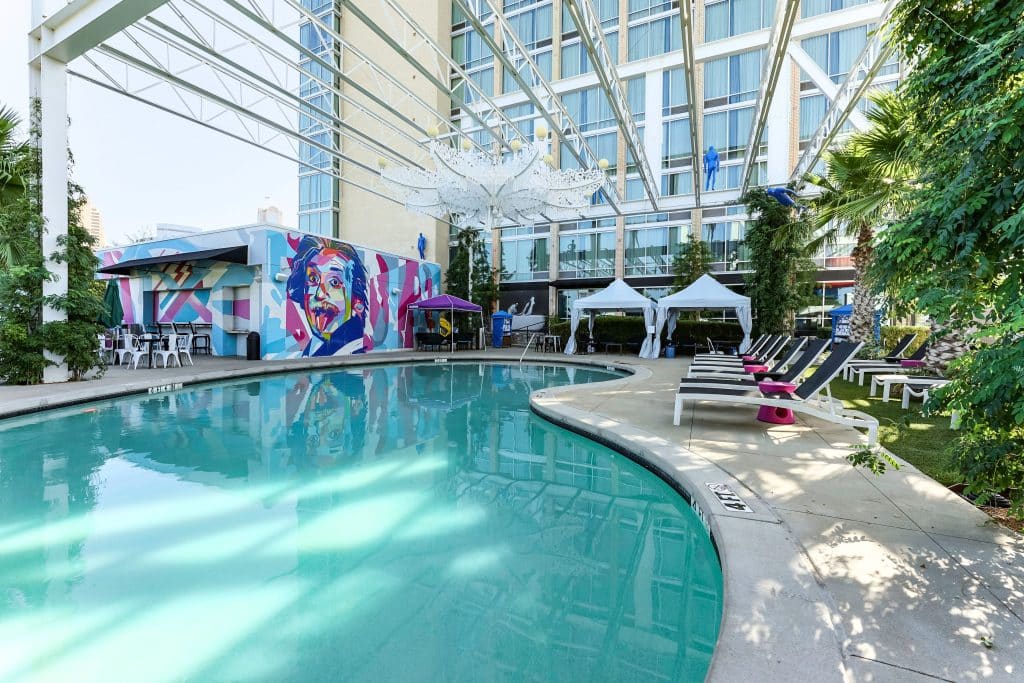 Outdoor pool view with Lorenzo hotel background view