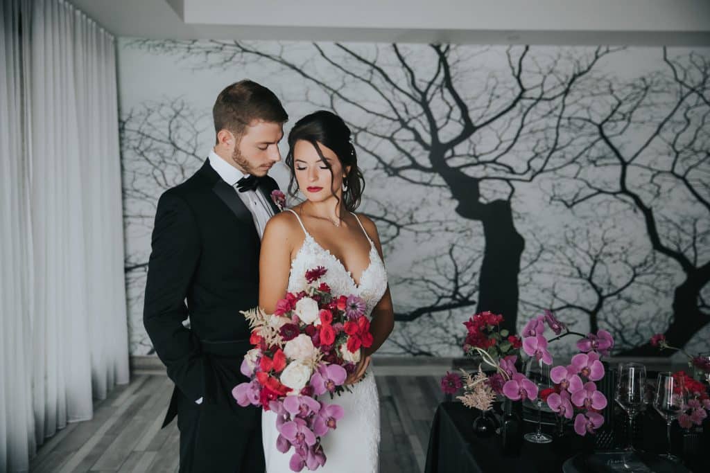 Wedding couple with pink flowers in Toast room