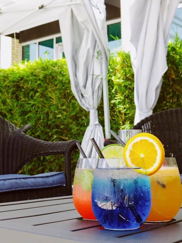 Colorful fruit-filled drinks by the pool