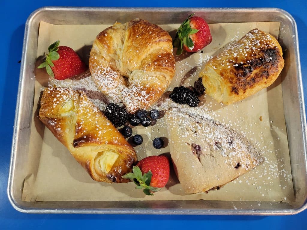 Tray of pastries and strawberries with sugar at the best hotel in Dallas, TX